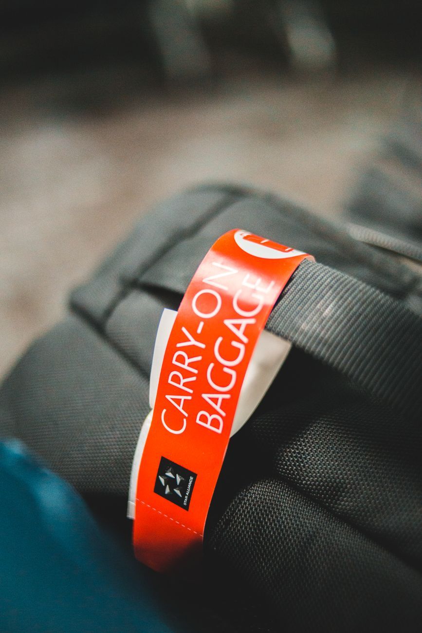 carry-on essentials, stress-free travel, carry-on packing list, travel organization, airport tips, travel accessories, in-flight comfort, hand luggage checklist, travel documents, packing hacks