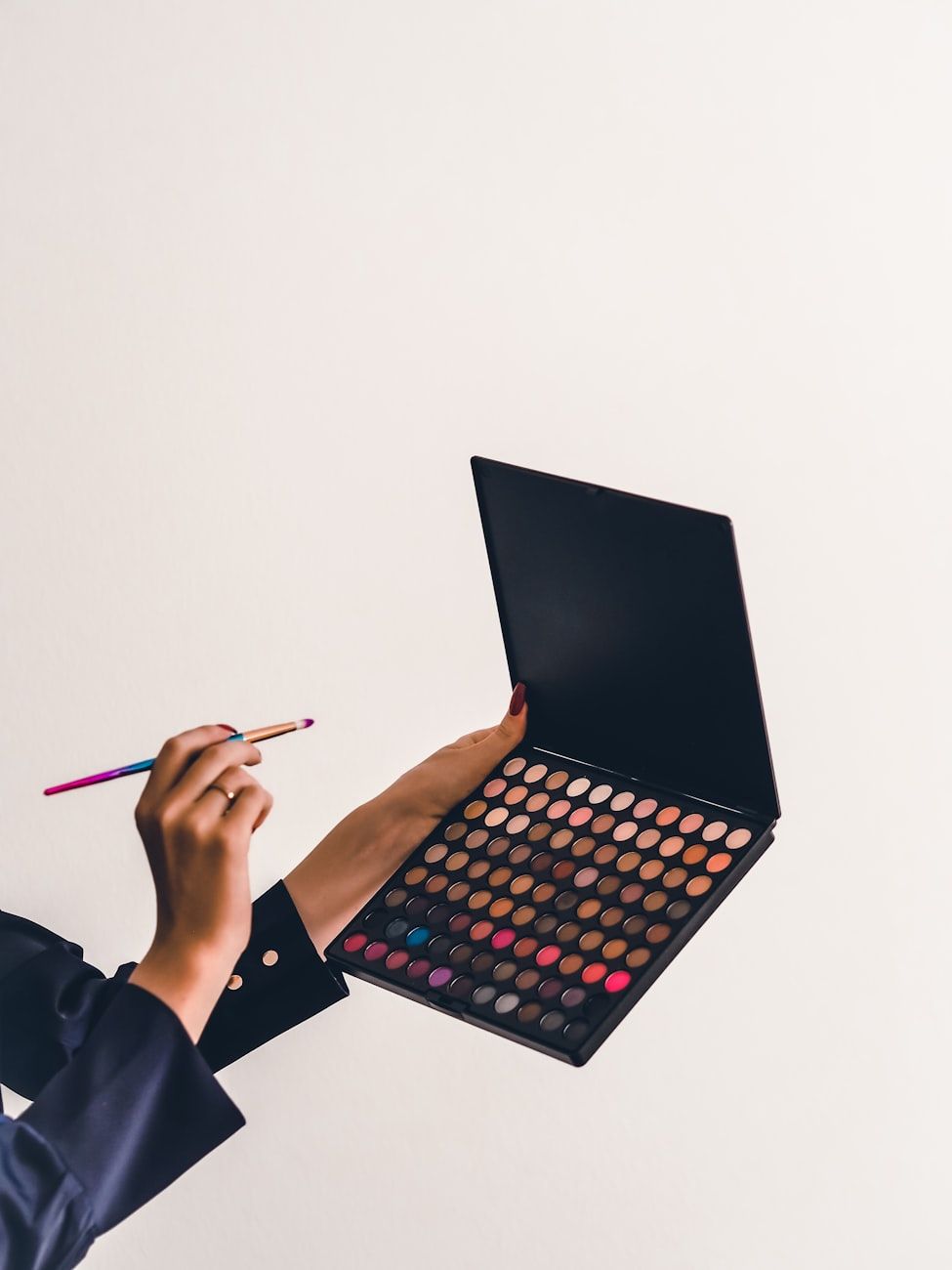 versatile eyeshadow palette, neutral shades, bold colors, makeup versatility, day-to-night look, eyeshadow finishes, palette selection tips, color theory, skin tone match, travel-friendly makeup