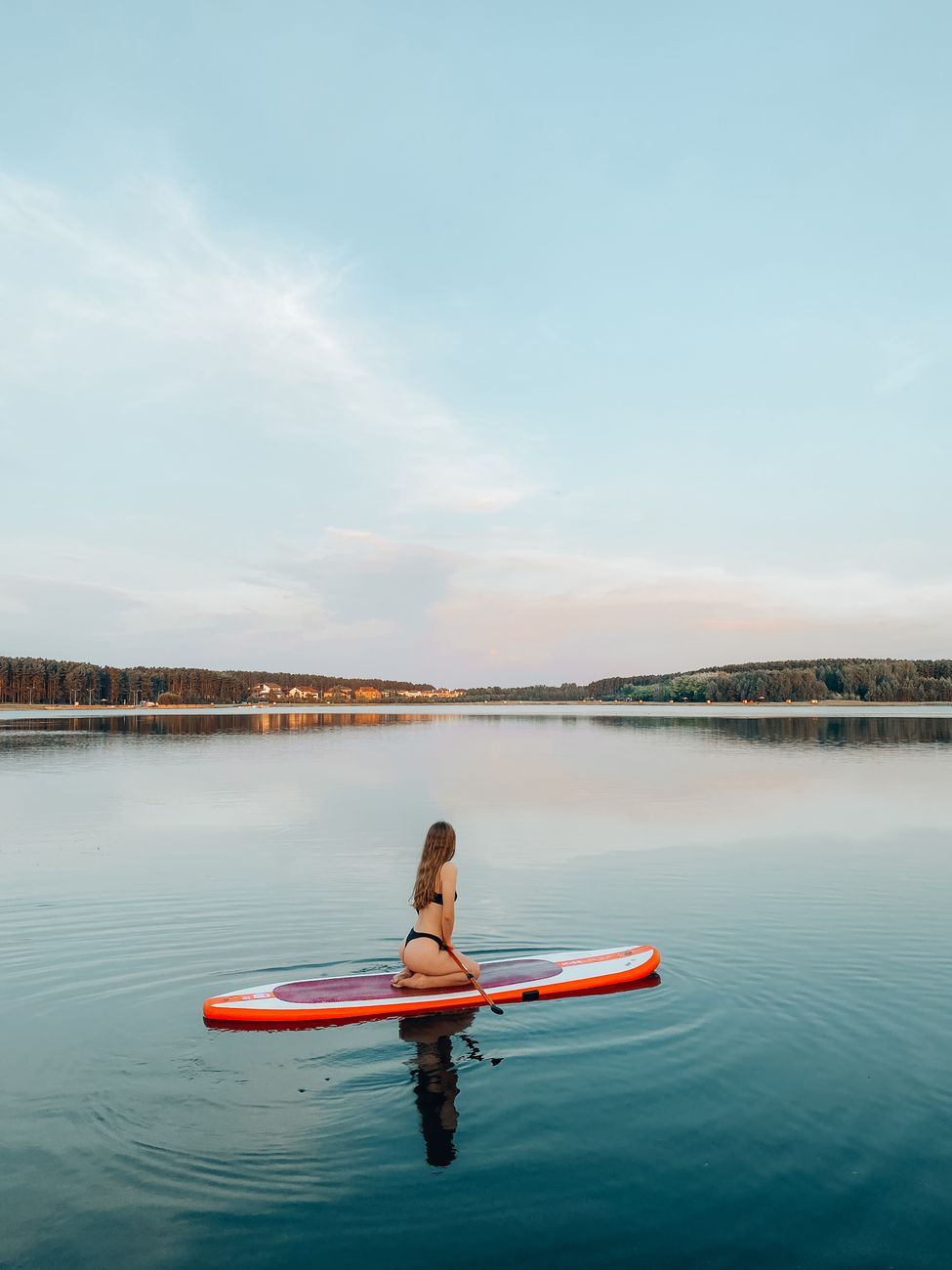 sunrise paddleboarding, morning SUP sessions, stand up paddle board, early morning exercise, calm water paddling, outdoor fitness, paddleboarding benefits, sunrise workout, water sports lifestyle, mindful morning routine