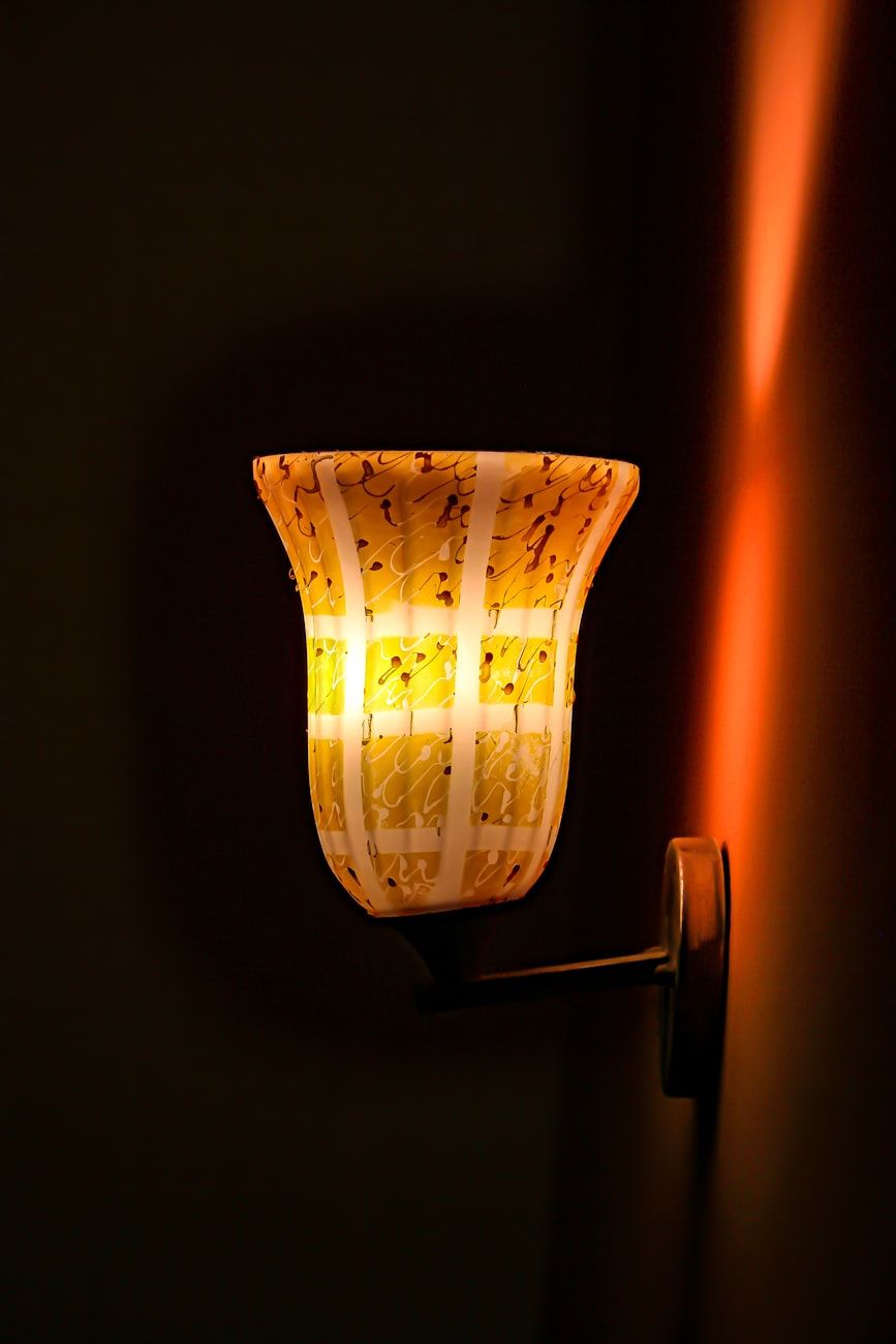 wall sconces, home lighting, warm light, cozy atmosphere, interior design, wall lamps, ambient lighting, living room decor, modern lighting, home comfort