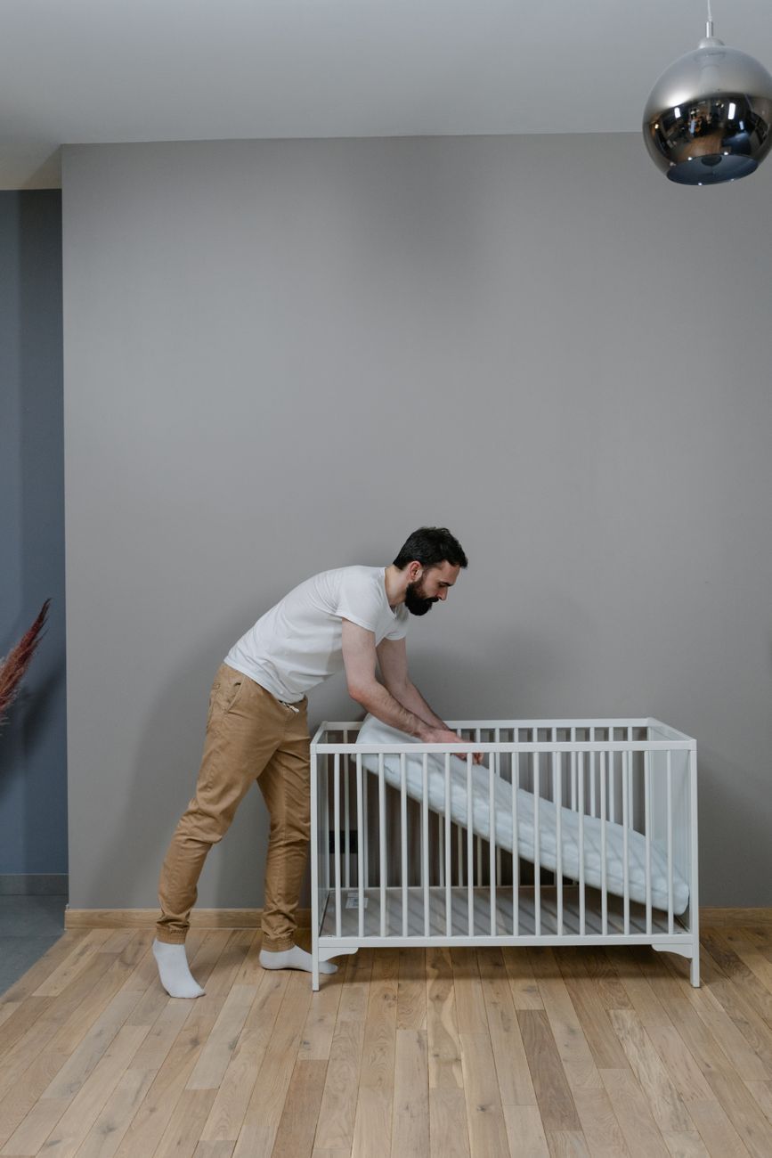 baby mattress safety, soft mattress risks, safe baby sleep, firm crib mattress, infant sleep safety, crib mattress guide, newborn sleep tips, SIDS prevention, baby nursery essentials, common baby sleep mistakes